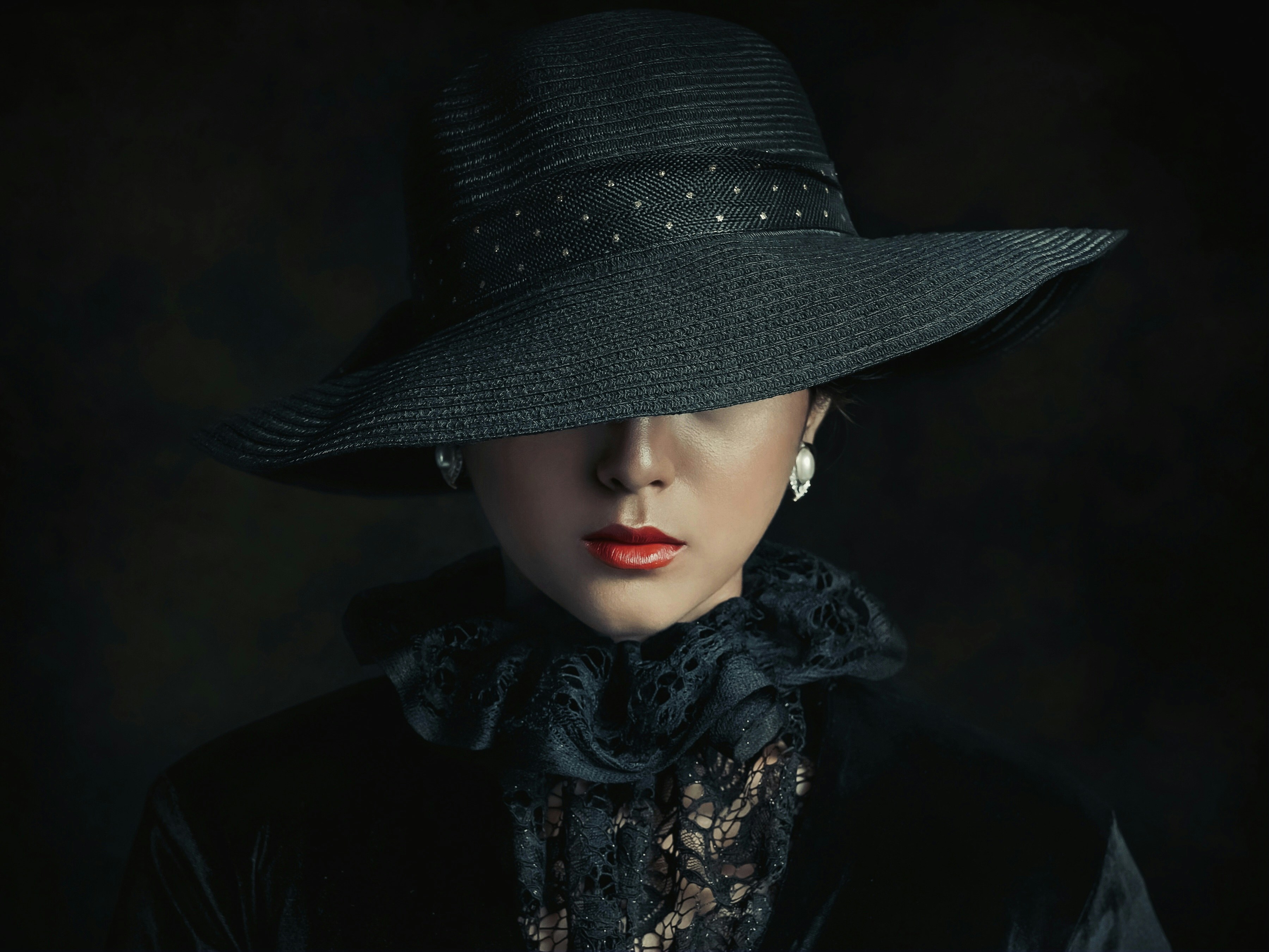 a woman wearing a black hat and scarf