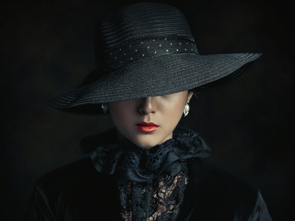 a woman wearing a black hat and scarf