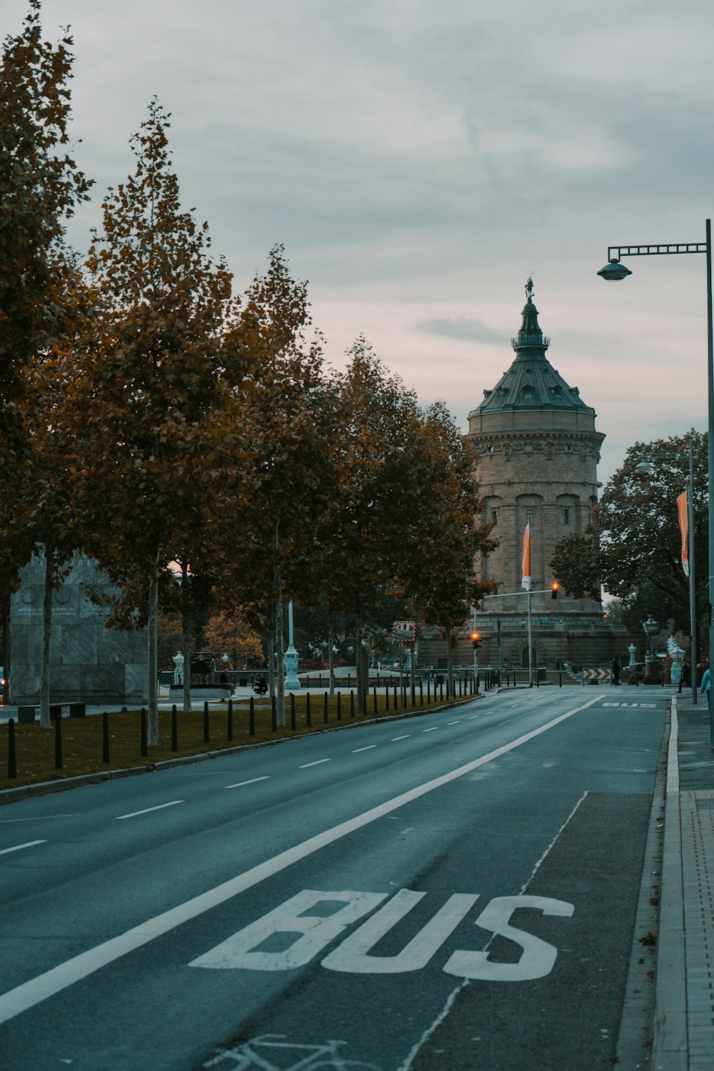 a street with a bus sign on the side of it