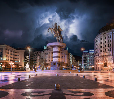 The square and its equestrian statue under a storm — Skopje, North Macedonia
