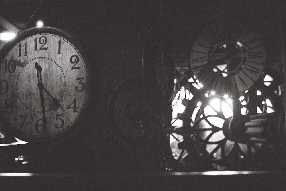 a black and white photo of a clock