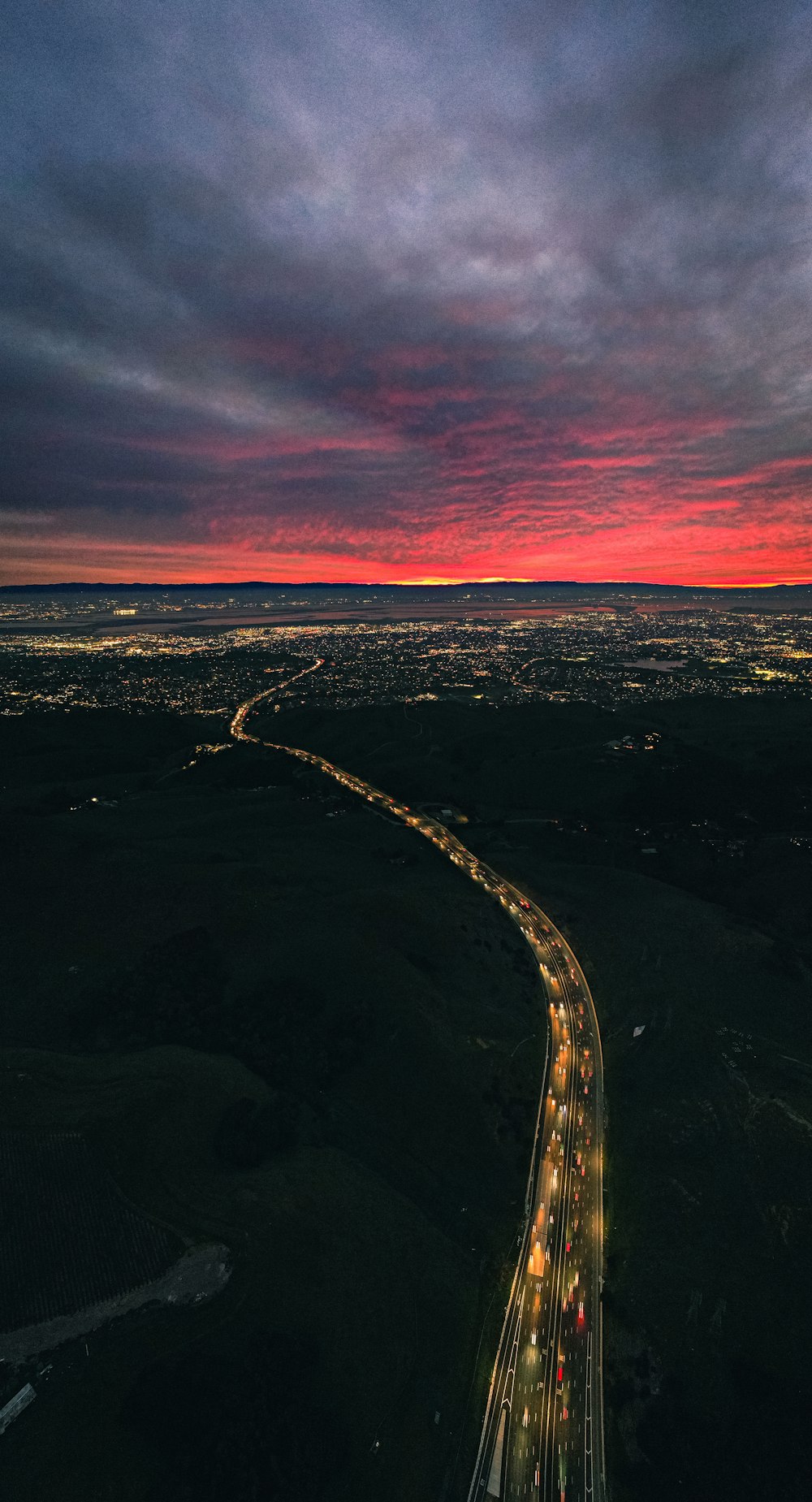 an aerial view of a highway at night