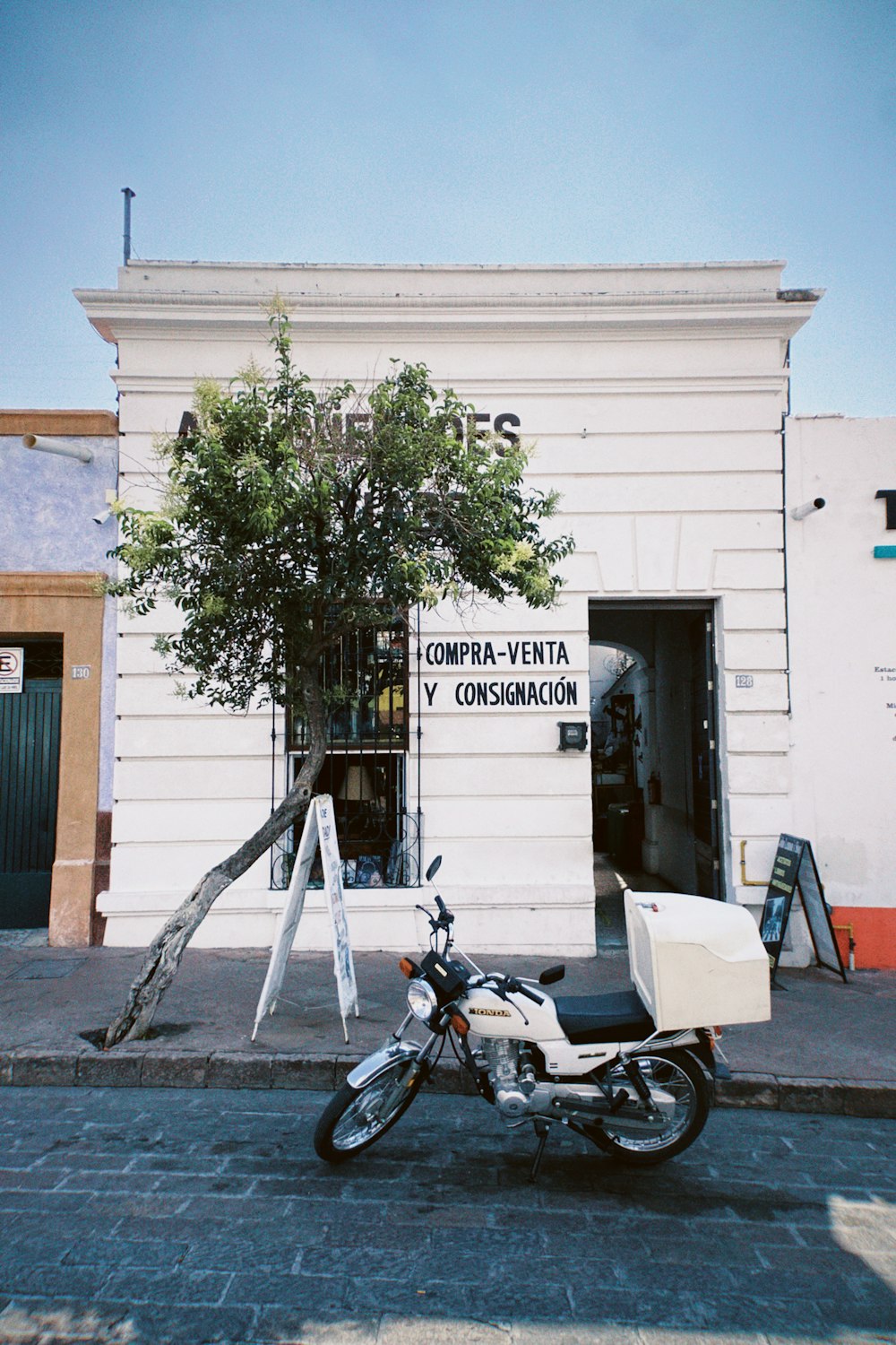 a motorcycle parked in front of a building