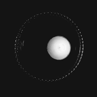 A round circle image centered on the page with soft, inviting colors.
