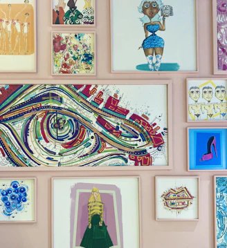 a wall covered in art and pictures of women