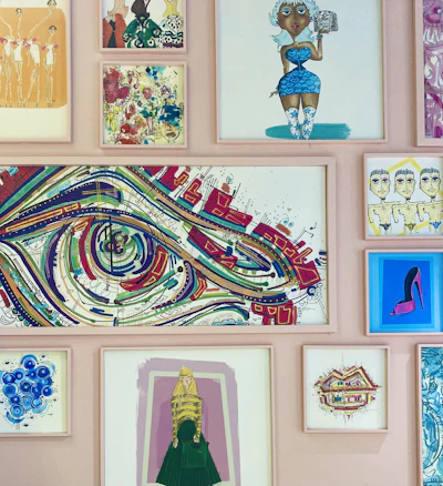 a wall covered in art and pictures of women