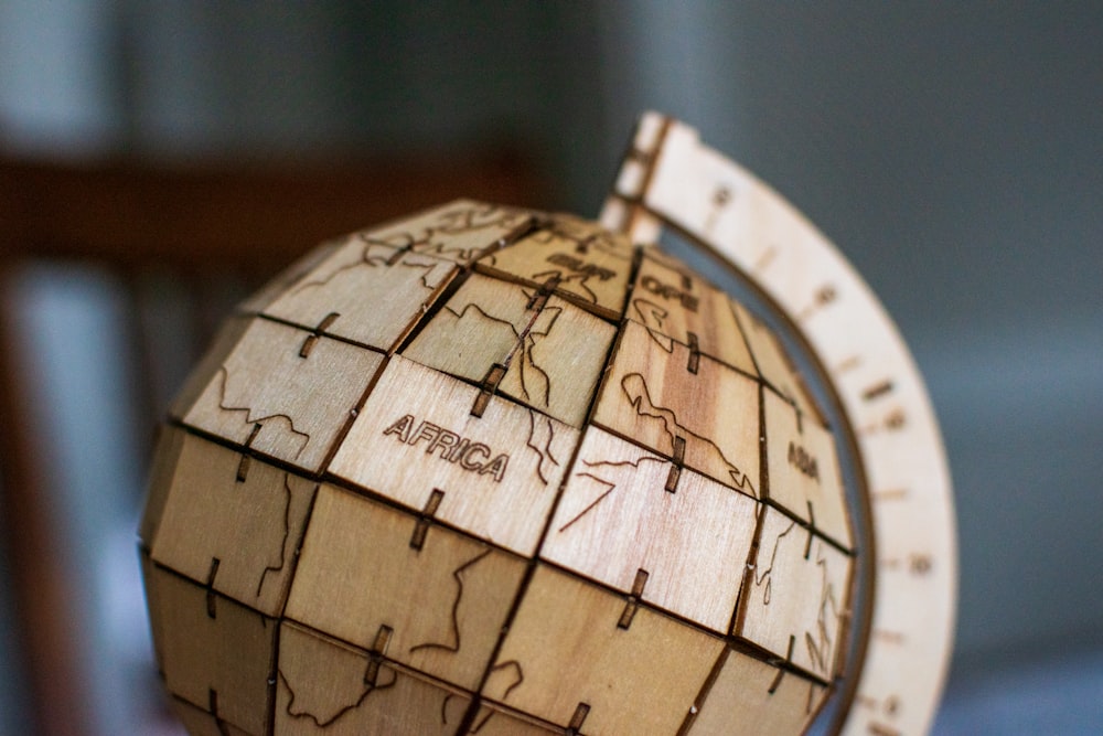 a wooden model of the earth on a table