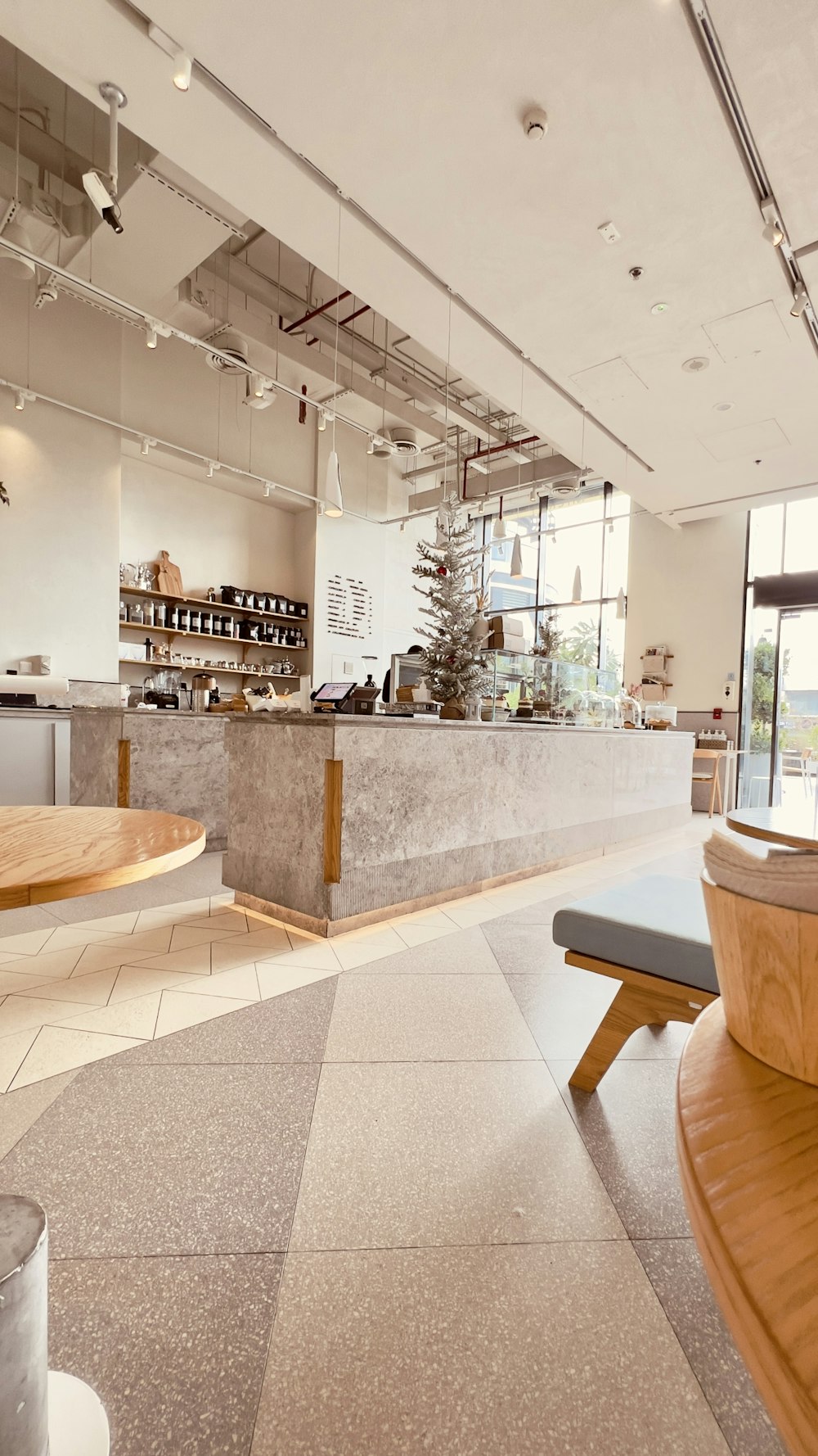 a restaurant with a counter and a wooden bench