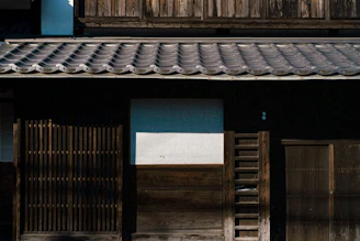 Sliding carousel showing the facade of a traditional house with terracotta roof tiles under bright sunlight