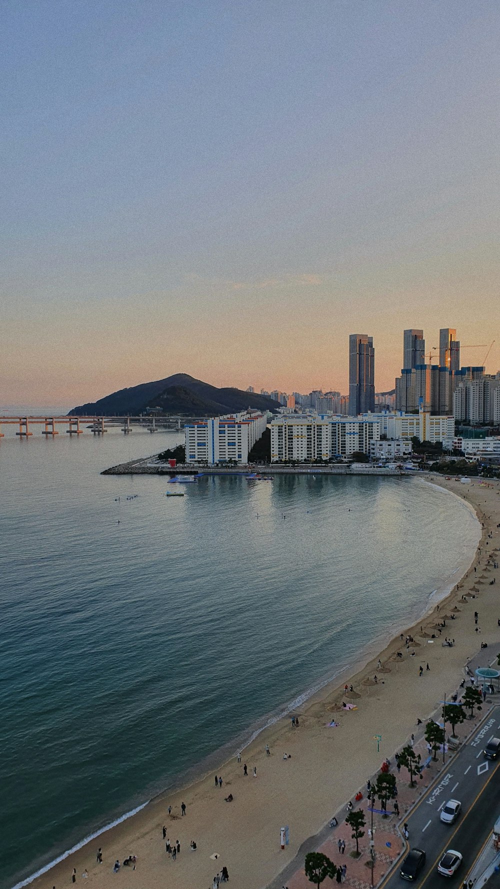 a view of a beach with a city in the background