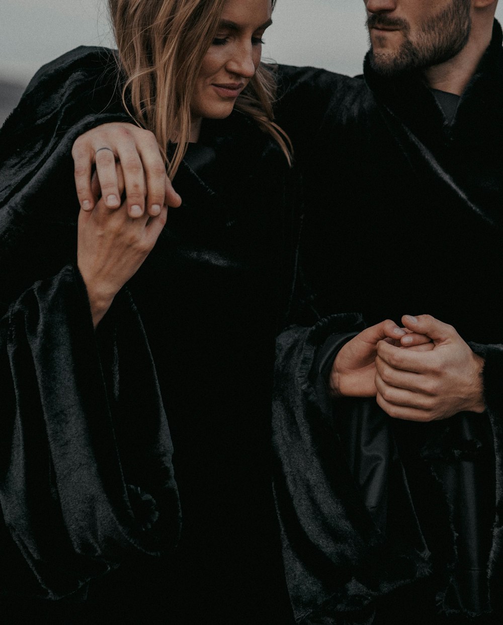 a man and a woman standing next to each other