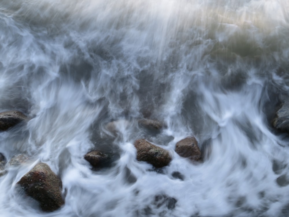 a bunch of rocks that are in the water