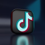 a black and blue icon with the letter j on it