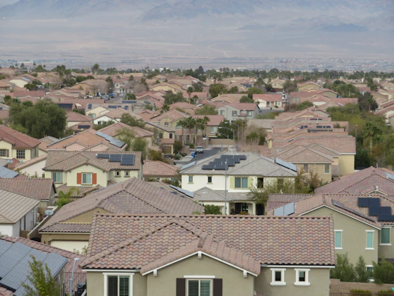 a lot of houses with a mountain in the background