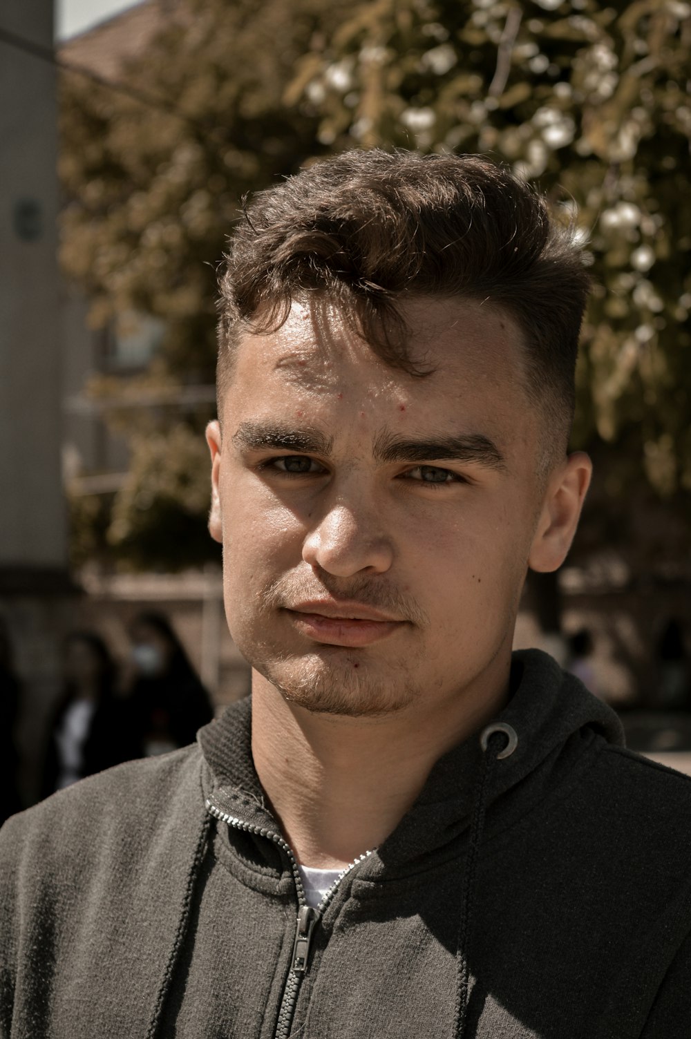 a close up of a person wearing a hoodie