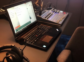 a laptop computer sitting on top of a desk