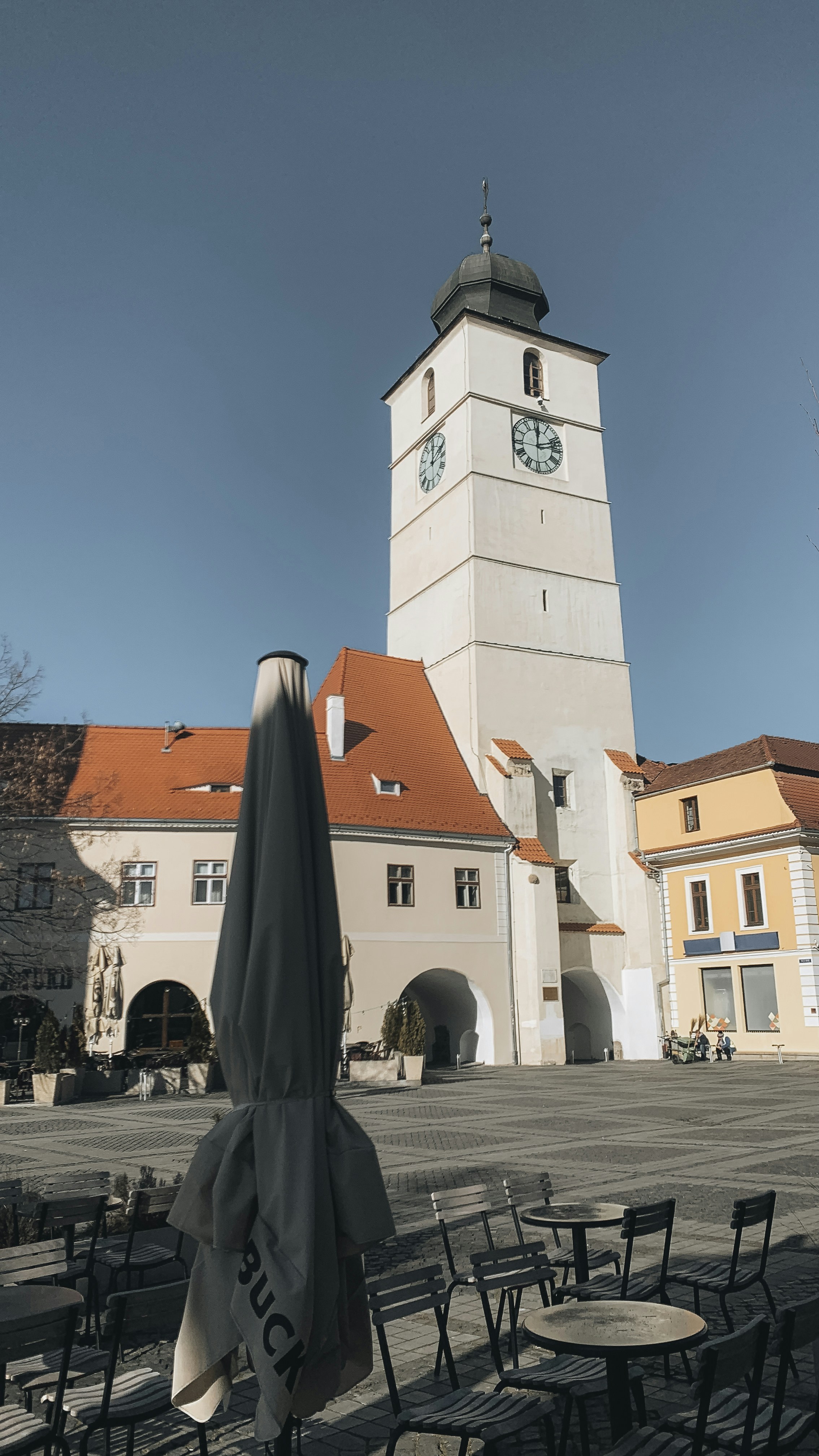 a clock tower in the middle of a town square