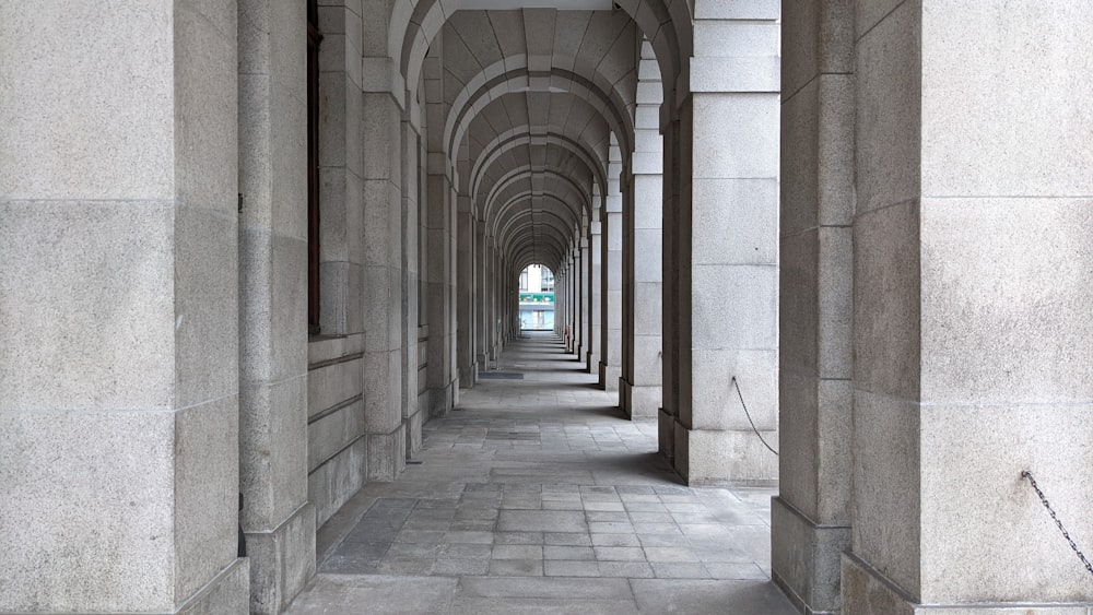 a row of stone arches on the side of a building