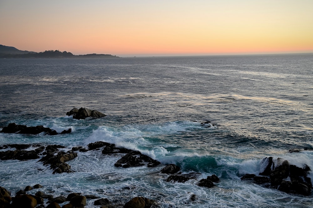 a body of water with waves coming in to shore