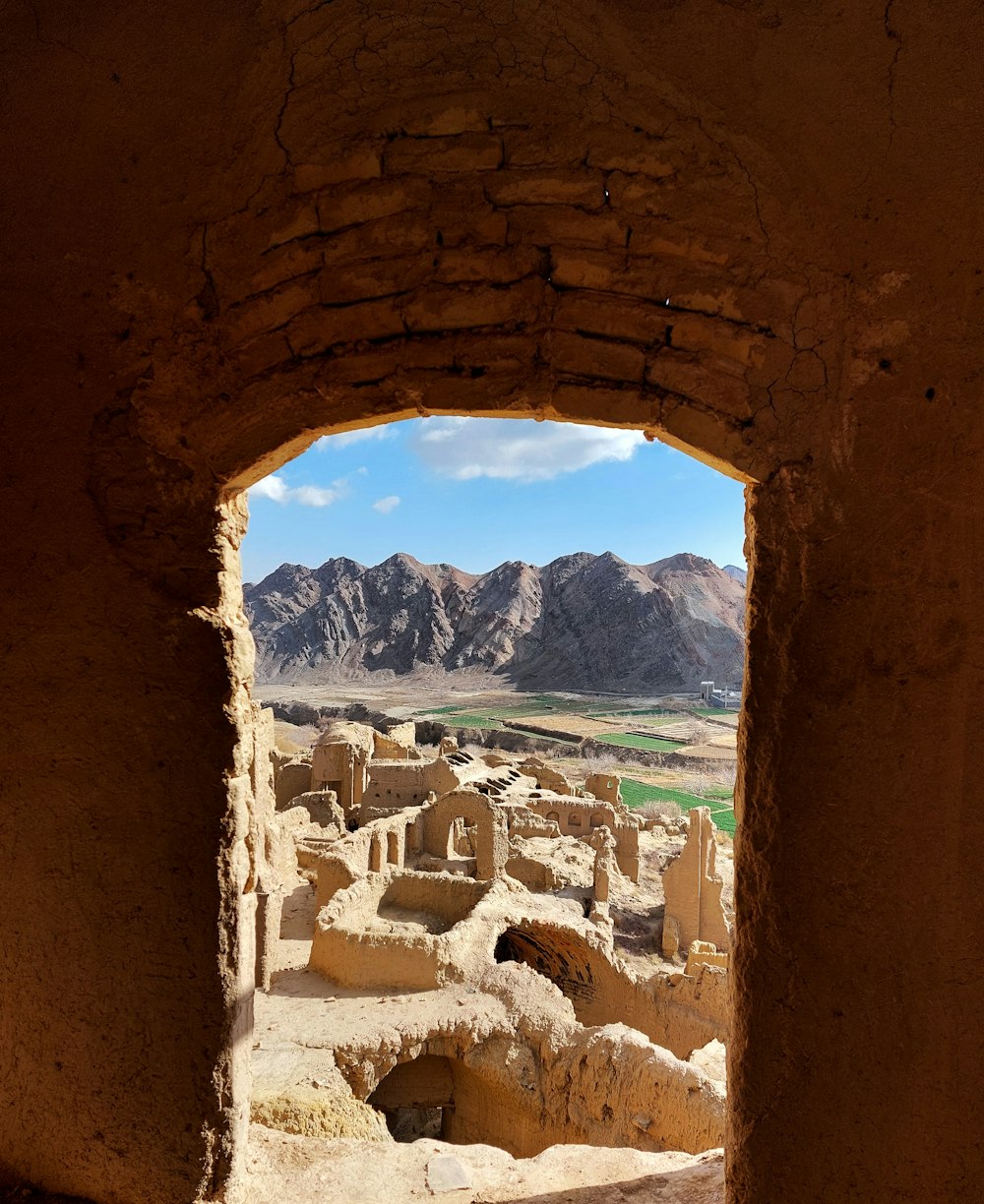 a view of a mountain range from a window in a building