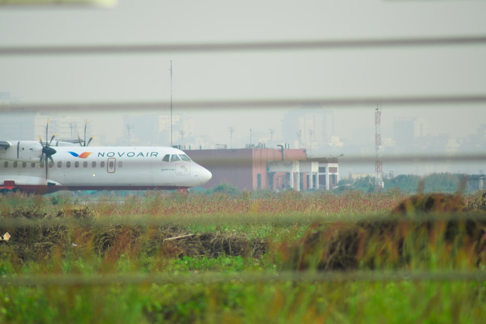 a large jetliner sitting on top of an airport runway