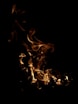 a close up of a fire on a black background