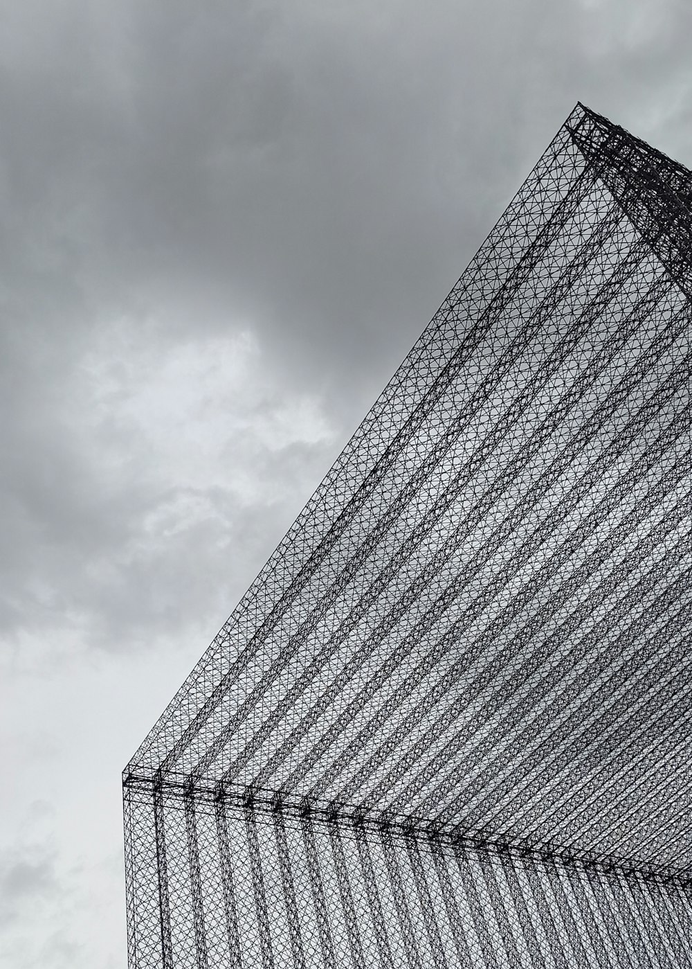 a very tall building with a sky background