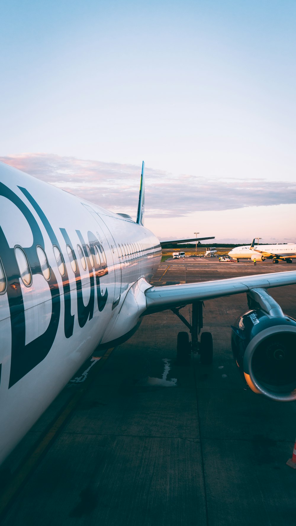 a large jetliner sitting on top of an airport tarmac