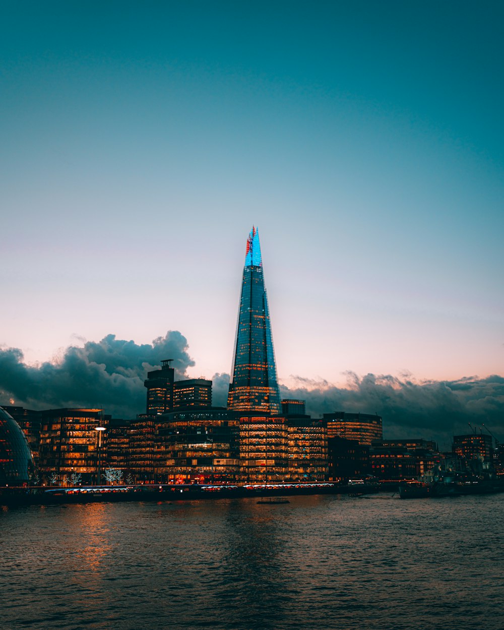 the shard of the building is lit up at night