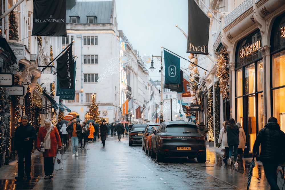 a city street filled with lots of people and cars