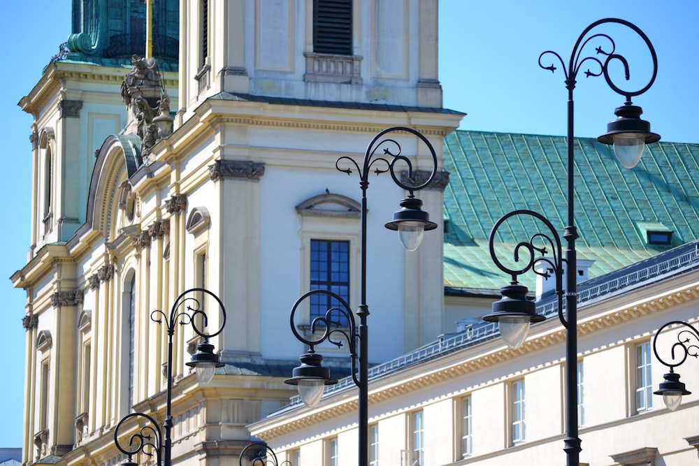 a tall white building with a clock tower