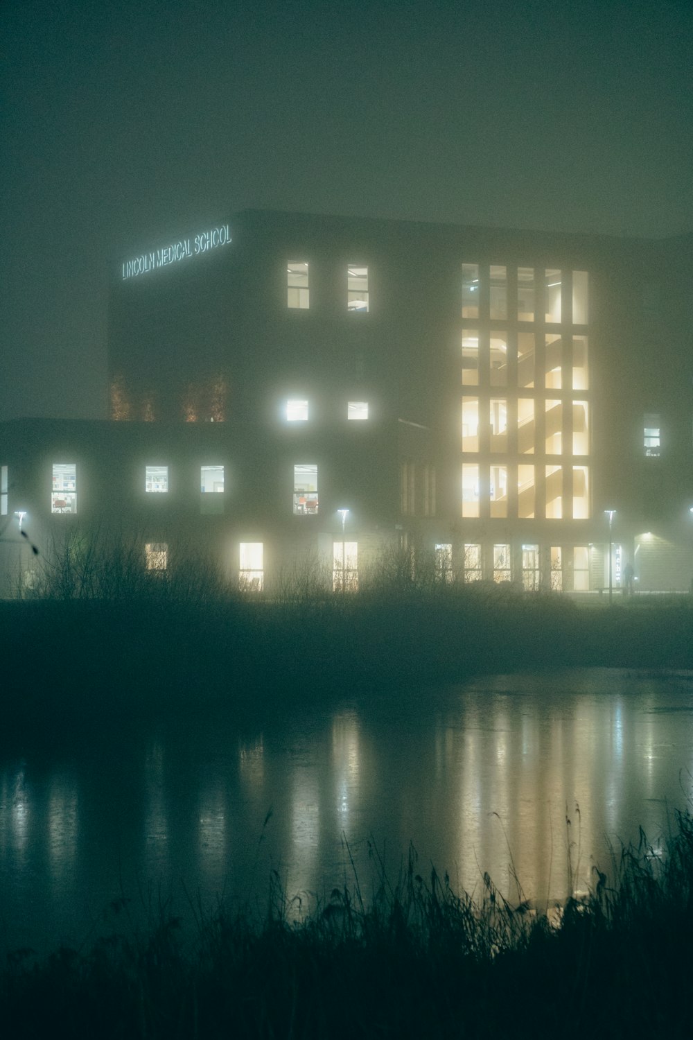 a large building with many windows lit up at night