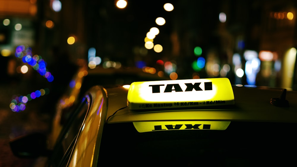 a taxi cab with a taxi light on top of it