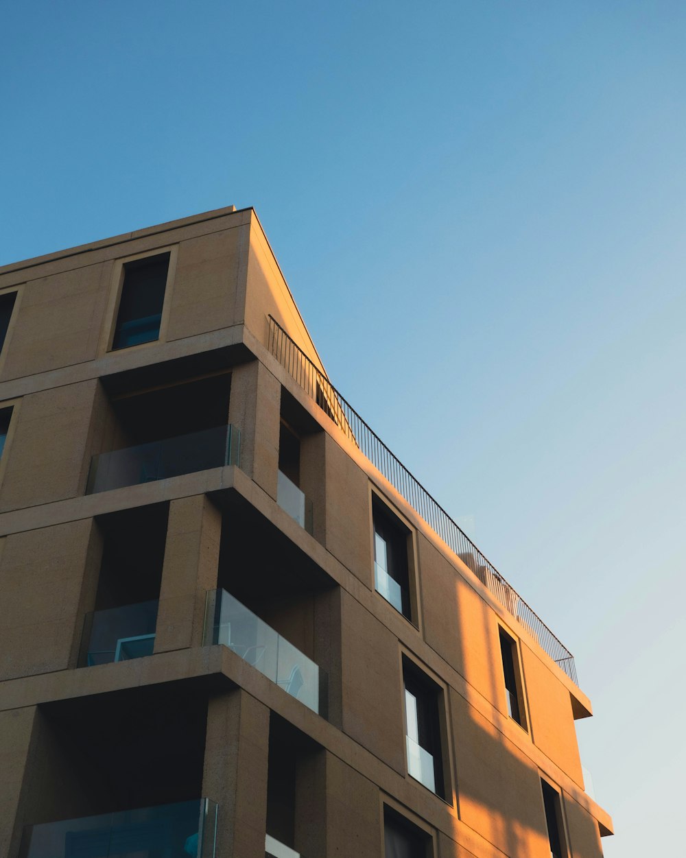 a tall building with balconies and balconies on top