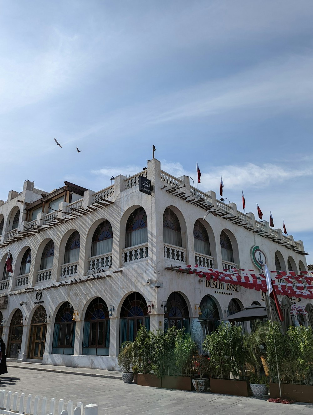 a large white building with many windows and balconies