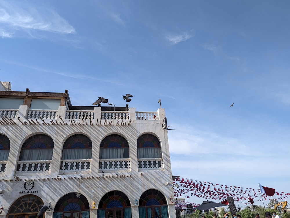 a white building with a blue sky in the background