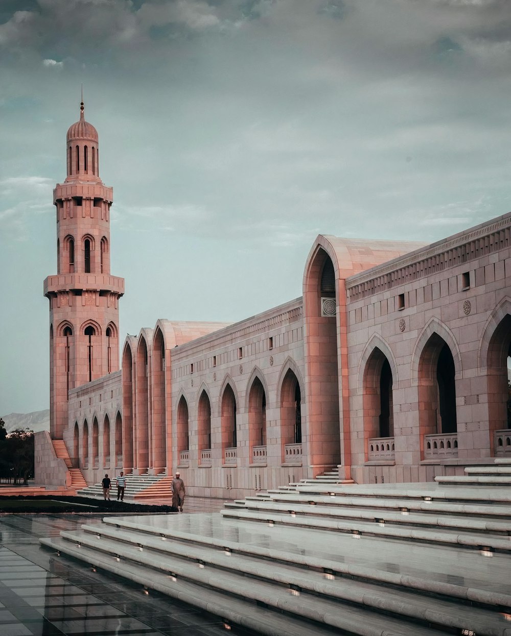 a large building with a clock tower in the background