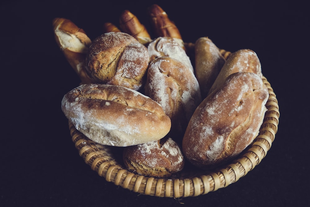 a basket filled with loaves of bread