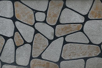 a close up of a wall made of rocks