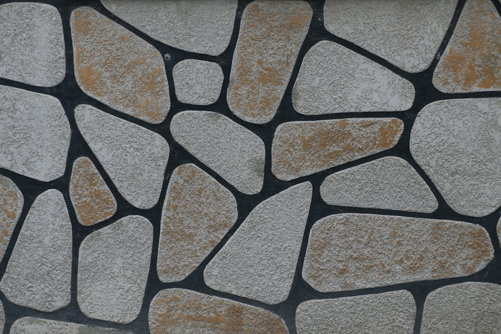 a close up of a wall made of rocks