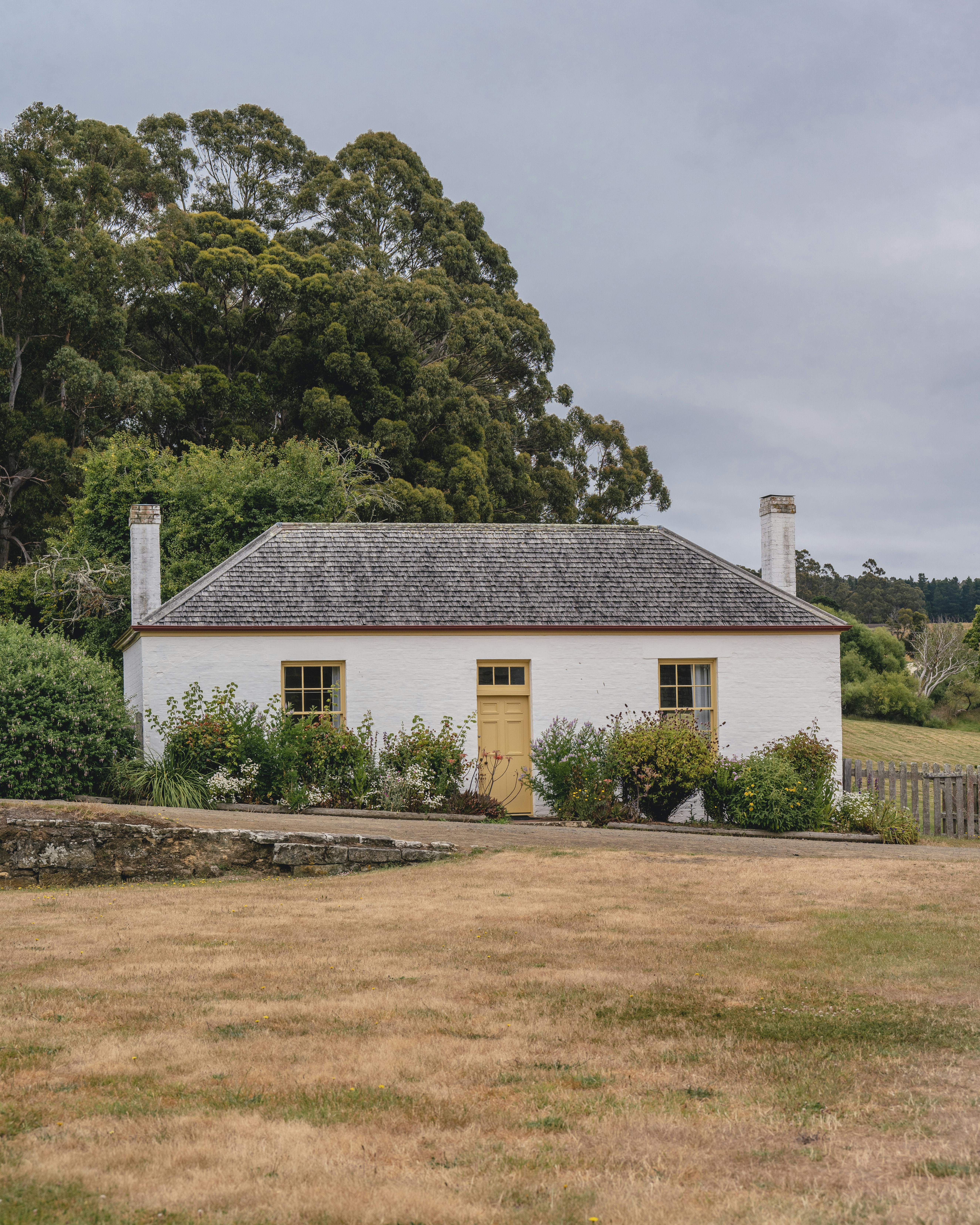 A cottage in the fields of Port Arthur Historic Site in Tasmania, Australia.