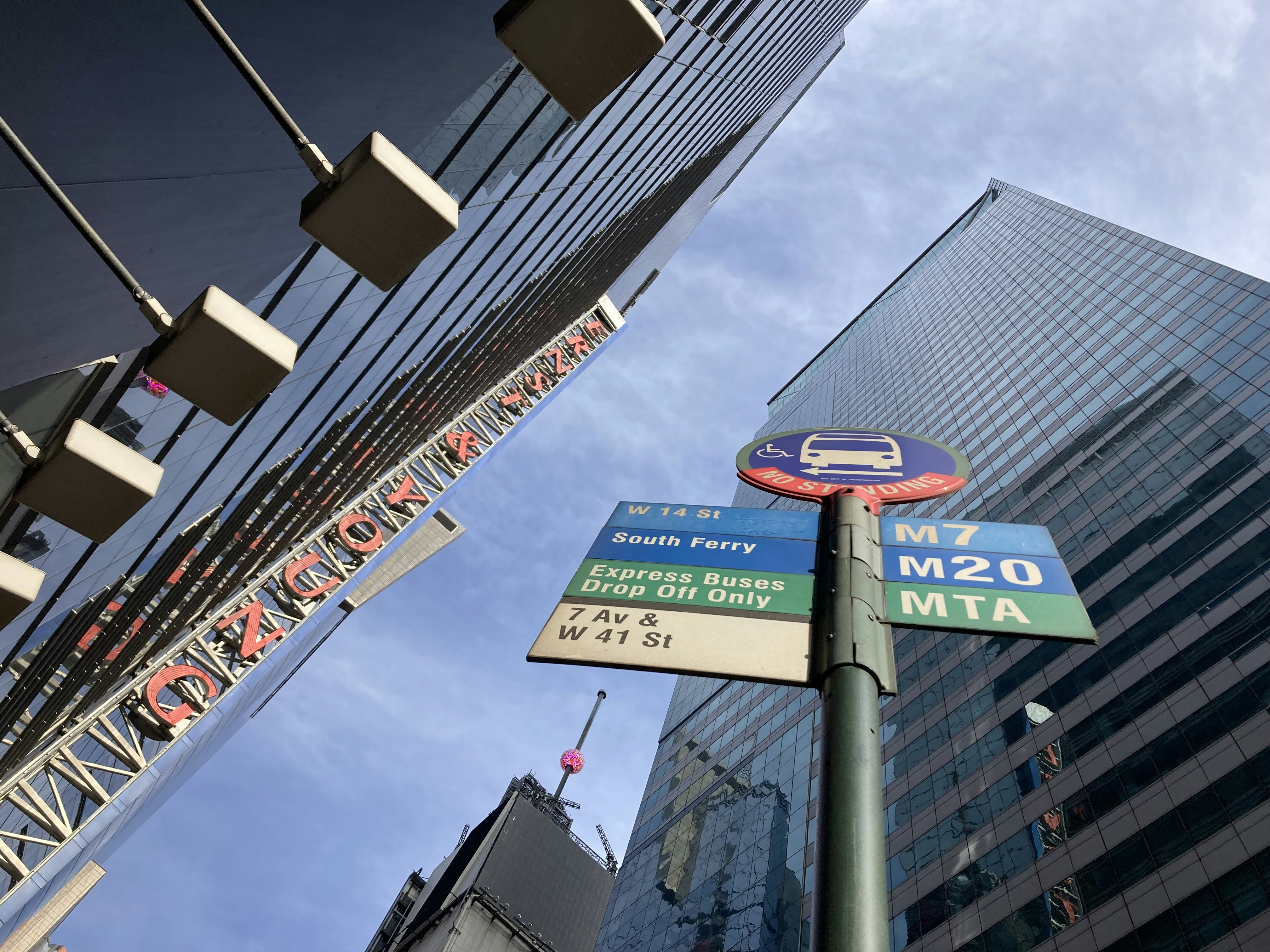 a street sign in front of a tall building
