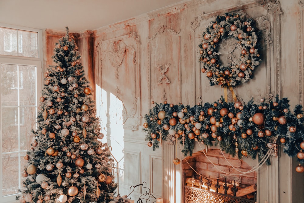 a living room decorated for christmas with a fireplace