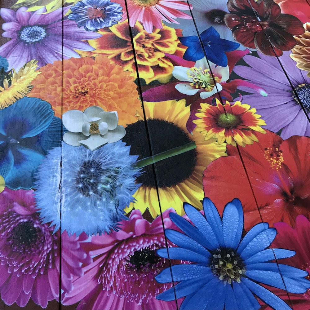 a close up of a table with flowers painted on it