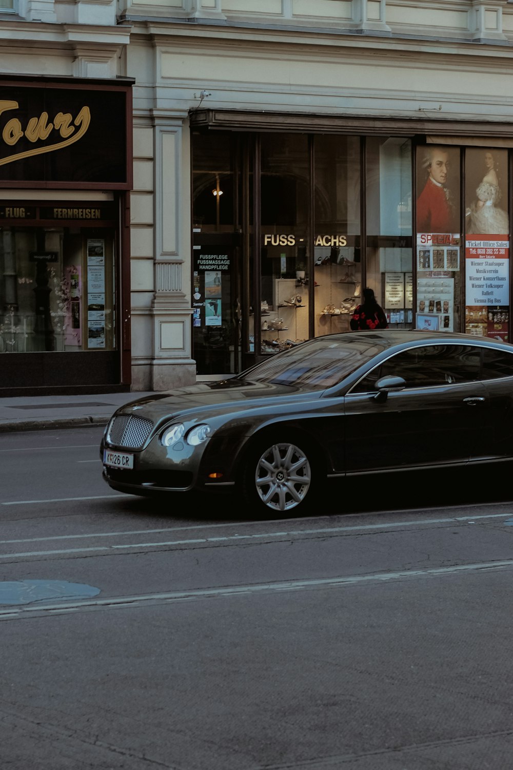 a black car parked on the side of the road