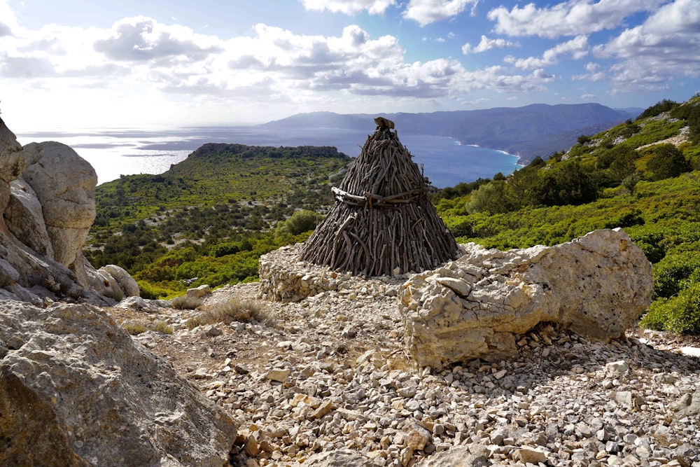 a small hut made out of sticks and rocks