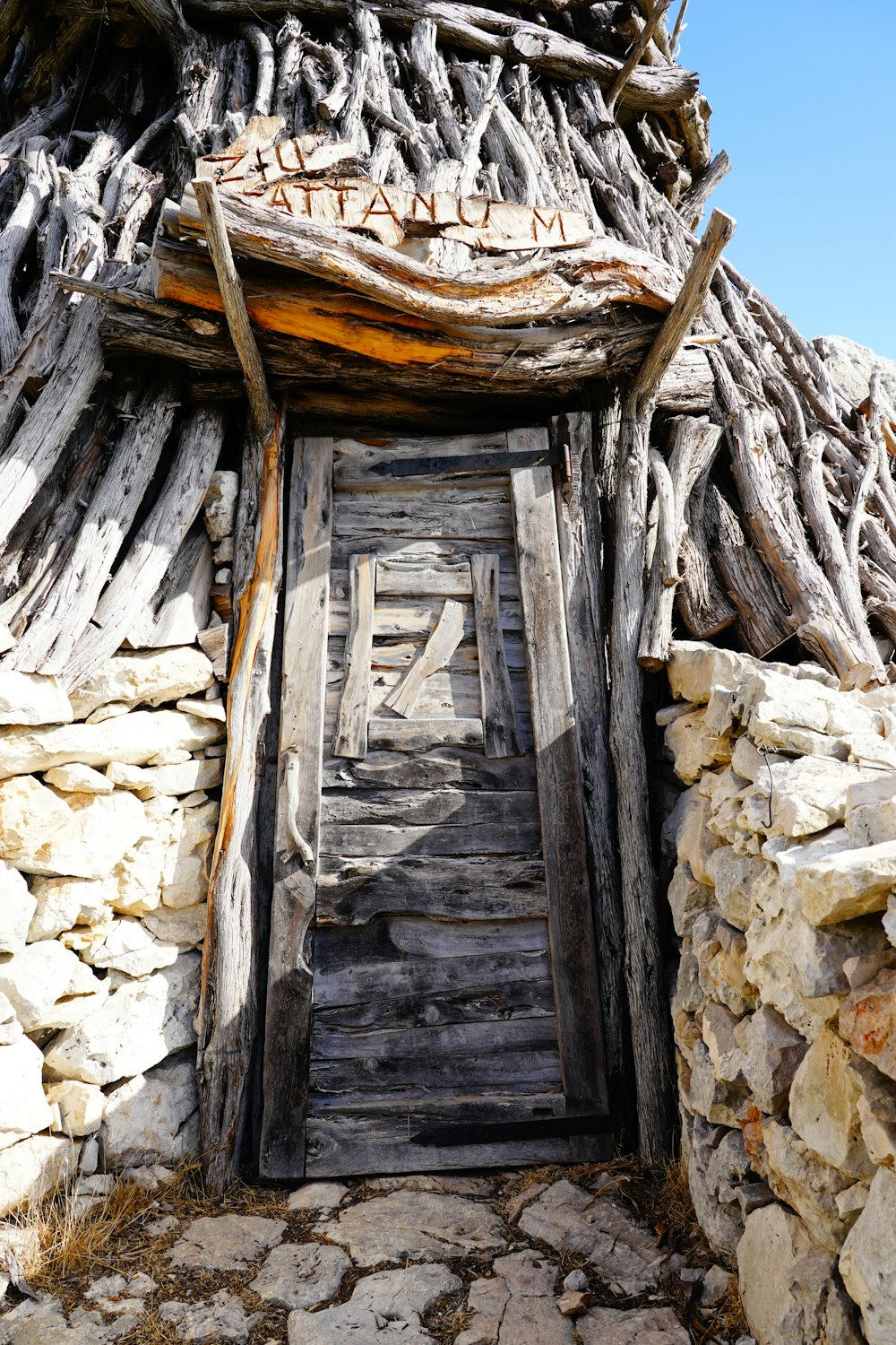 an old wooden door in a stone wall