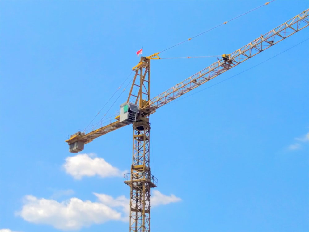 a large crane that is on top of a building