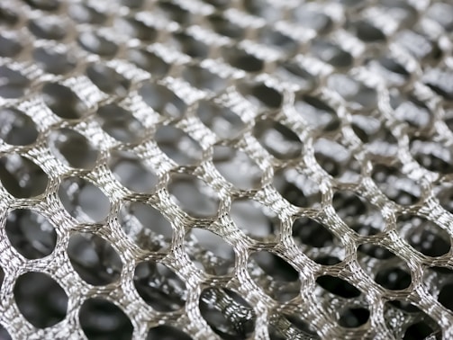 A close-up of stainless steel wire mesh showcasing its intricate pattern.