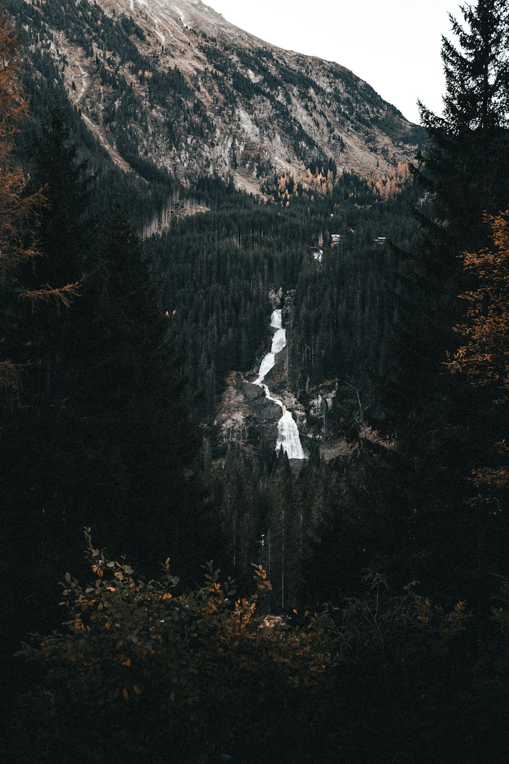 a scenic view of a mountain with a river running through it